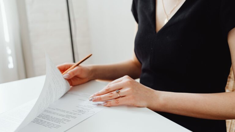 Woman signing legal documents